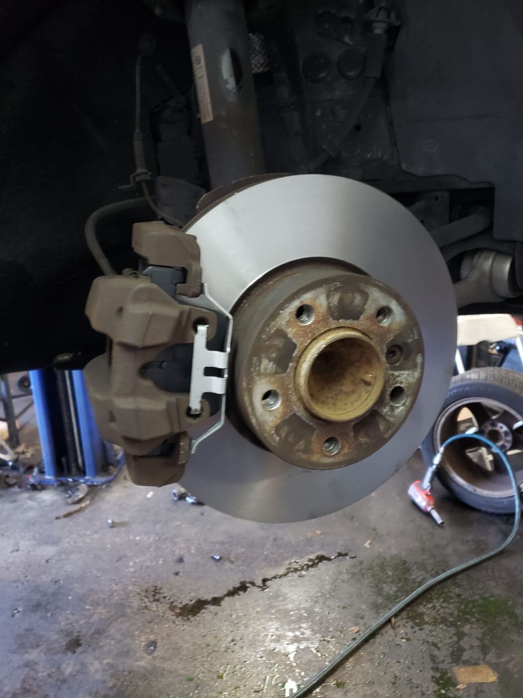 New rear brake rotor and caliper